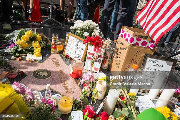 Flowers are placed on Robin Williams Hollywood Walk of Fame star on August 12, 2014 in Los Angeles, California.