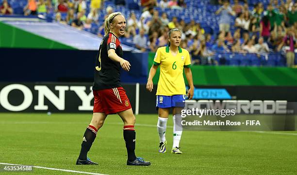 Lena Petermann of Germany reacts after she fails to score her team's equalizing goal by penalty during the FIFA U-20 Women's World Cup 2014 group B...