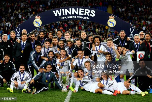 Madrid celebrate following their 2-0 victory during the UEFA Super Cup between Real Madrid and Sevilla FC at Cardiff City Stadium on August 12, 2014...