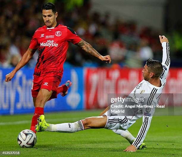 Sergio Ramos of Real Madrid competes for the ball with Vitolo of Sevilla during the UEFA Super Cup match between Real Madrid and Sevilla at Cardiff...