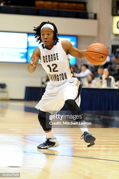 Danni Jackson of the George Washington Colonials dribbles the ball during a womens college basketball game against the California Golden Bears on...