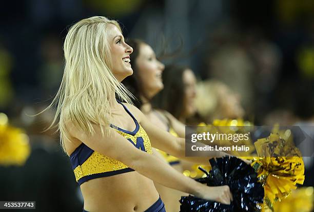 Members of the Michigan Wolverines dance team perform during the second half of the game against Coppin State Eagles at Crisler Center on November...