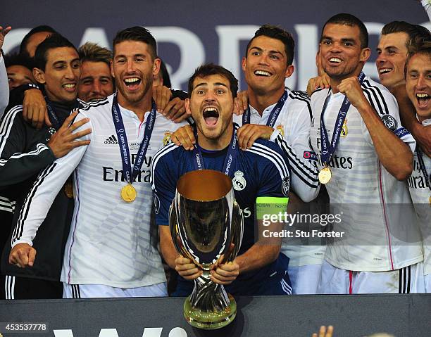 Real Madrid players Sergio Ramos, Iker Casillas, Ronaldo and Pepe celebrate with the trophy after the UEFA Super Cup match between Real Madrid and...