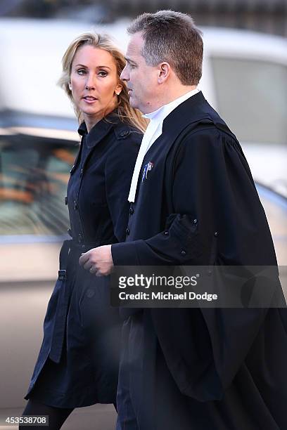 Tania Hird, wife of suspended Essendon Bombers coach James Hird, arrives at the Supreme Court ahead of the case looking into the AFL-ASADA...