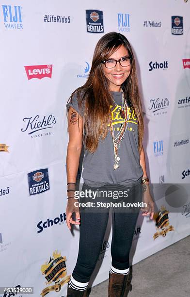 Actress Vanessa Marcil attends Kiehl's LifeRide for amfAR co-hosted by FIJI Water on August 12, 2014 in New York City.