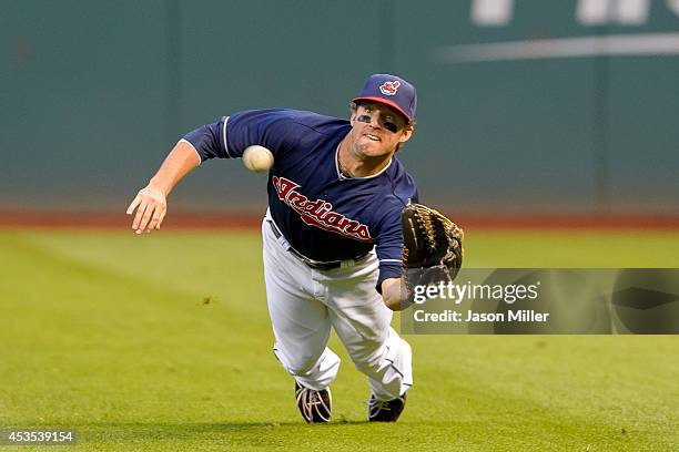 Right fielder Tyler Holt of the Cleveland Indians catches a line drive off the bat of Cliff Pennington of the Arizona Diamondbacks to end the top of...