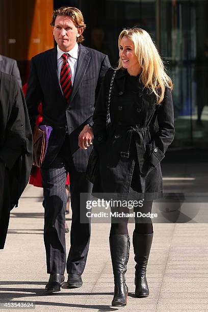 Suspended Essendon Bombers coach James Hird leaves for a break with wife Tania Hird at the Supreme Court during the case looking into the AFL-ASADA...