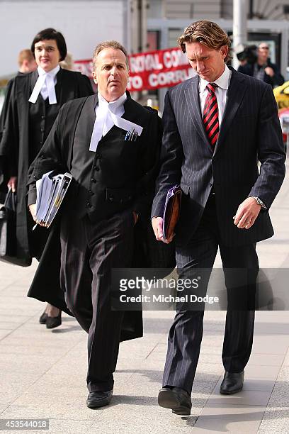 Suspended Essendon Bombers coach James Hird arrives back with Barrister Nick Harrington at the Supreme Court during the case looking into the...