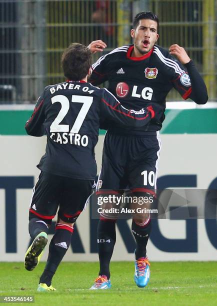 Emre Can of Leverkusen celebrates his team's second goal with team mate Gonzalo Castro during the German Cup Round of 16 match between SC Freiburg...