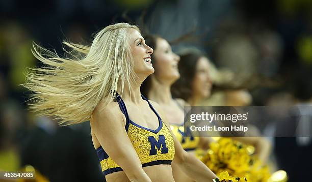 Members of the Michigan Wolverines dance team perform during the second half of the game against Coppin State Eagles at Crisler Center on November...