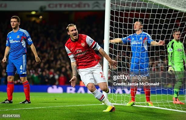 Nicklas Bendtner of Arsenal celebrates scoring the opening goal during the Barclays Premier League match between Arsenal and Hull City at Emirates...