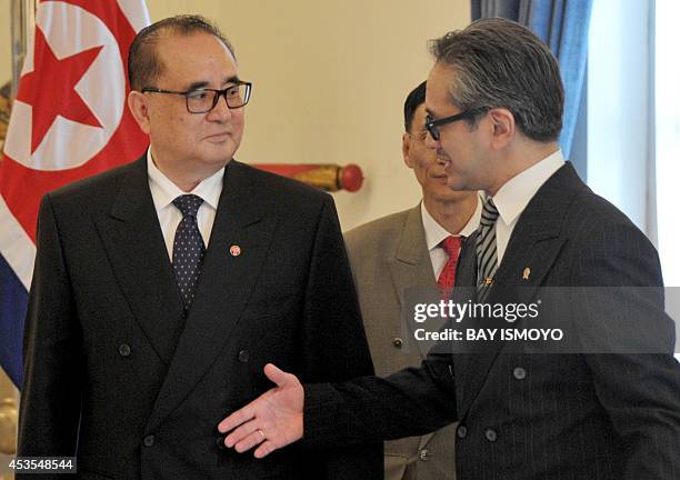 Indonesia's Foreign Minister Marty Natalegawa greets his North Korean counterpart Ri Su Yong during their meeting in Jakarta on August 13, 2014. Ri...