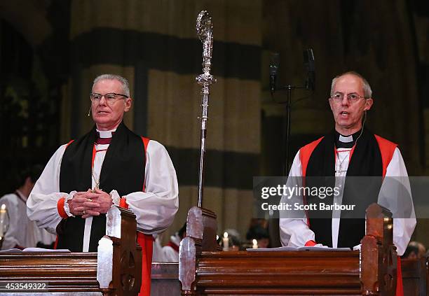 The Archbishop of Canterbury, Justin Welby and Archbishop Philip Freier sing as they attend the inauguration service of Melbourne Archbishop Philip...