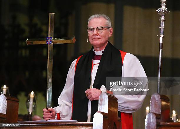 Archbishop Philip Freier holds a cross during the inauguration service of Melbourne Archbishop Philip Freier at St. Paul's Cathedral on August 13,...