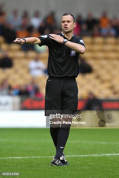 Referee Stuart Attwell in action during the Capital One Cup First Round match between Wolverhampton Wanderers and Northampton Town at Molineux on...