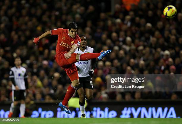 Luis Suarez of Liverpool scores his first goal from a long range effort during the Barclays Premier League match between Liverpool and Norwich City...