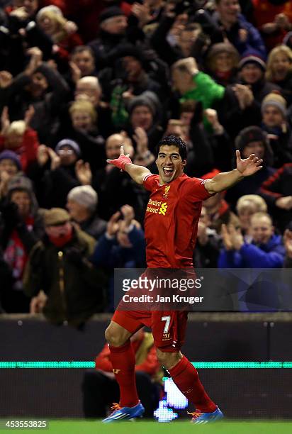 Luis Suarez of Liverpool celebrates his first goal from a long range effort during the Barclays Premier League match between Liverpool and Norwich...