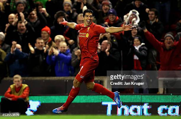Luis Suarez of Liverpool celebrates his first goal from a long range effort during the Barclays Premier League match between Liverpool and Norwich...