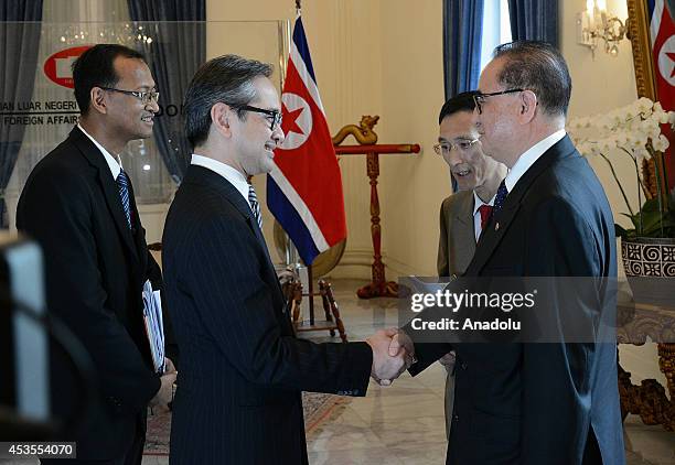 North Korea's Foreign Minister Ri Su Yong is welcomed by his Indonesian counterpart Marty Natalegawa prior to their meeting at the Ministry of...
