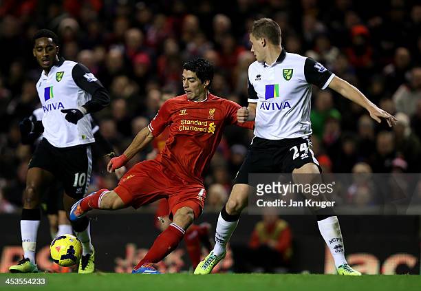 Luis Suarez of Liverpool scores his third goal during the Barclays Premier League match between Liverpool and Norwich City at Anfield on December 4,...