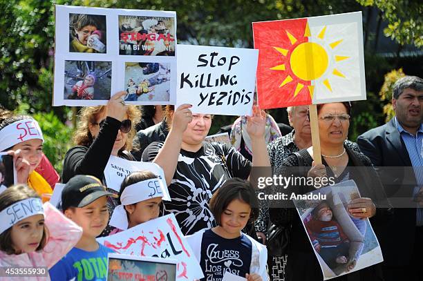 Yezidis living in Belgium, take part in a demonstration at Schuman Square to protest the attacks of Islamic State in Iraq, on August 13, 2014 in...