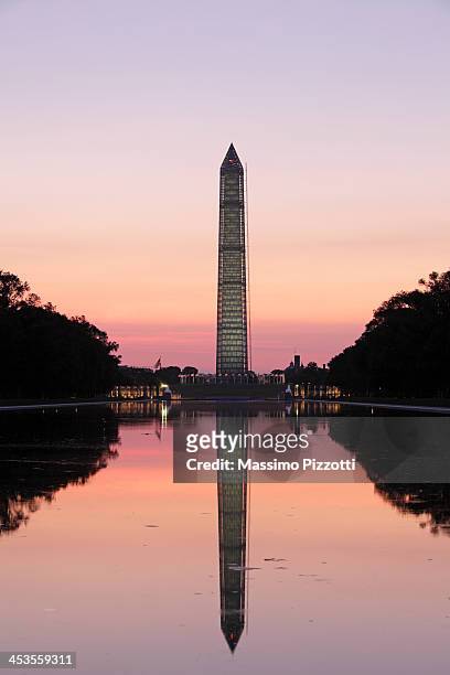 the obelisk or washington monument at sunrise - reflecting pool stock-fotos und bilder