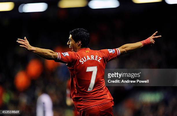 Luis Suarez of Liverpool celebrates his first goal during the Barclays Premier League match between Liverpool and Norwich City at Anfield on December...