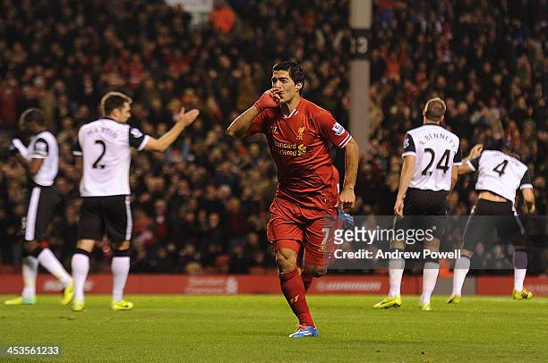 Luis Suarez of Liverpool celebrates his third goal during the Barclays Premier League match between Liverpool and Norwich City at Anfield on December...