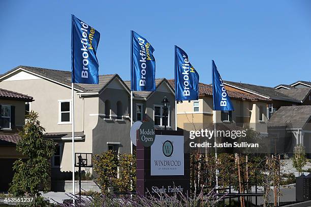 Sign advertising new homes is posted at a housing development on December 4, 2013 in Dublin, California. According to a Commerce Department report,...