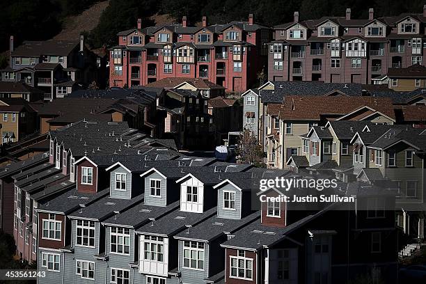 Rows of new homes line a street in a housing development on December 4, 2013 in Oakland, California. According to a Commerce Department report, sales...