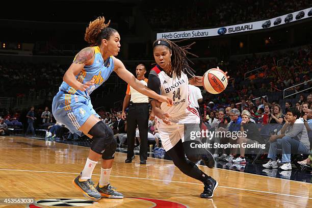 Tierra Ruffin-Pratt of the Washington Mystics drives against Courtney Clements of the Chicago Sky at the Verizon Center on August 13, 2014 in...