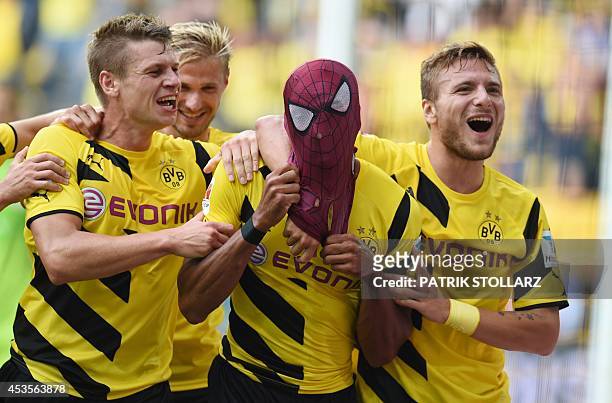 Dortmund's Italian striker Circo Immobile , Dortmund's Polish defender Lukasz Piszczek celebrate after Dortmund's Gabonese striker Pierre-Emerick...