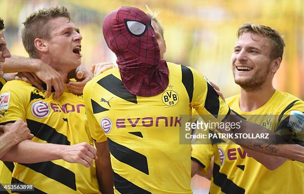 Dortmund's Italian striker Circo Immobile , Dortmund's Polish defender Lukasz Piszczek celebrate after Dortmund's Gabonese striker Pierre-Emerick...