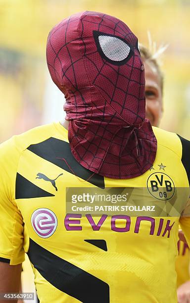 Dortmund's Gabonese striker Pierre-Emerick Aubameyang, who put on a Spiderman mask, celebrates scoring the 2-0 goal during the German Supercup...