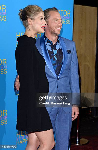 Rosamund Pike and Simon Pegg attend the UK Premiere of "Hector And The Search For Happiness" at Empire Leicester Square on August 13, 2014 in London,...