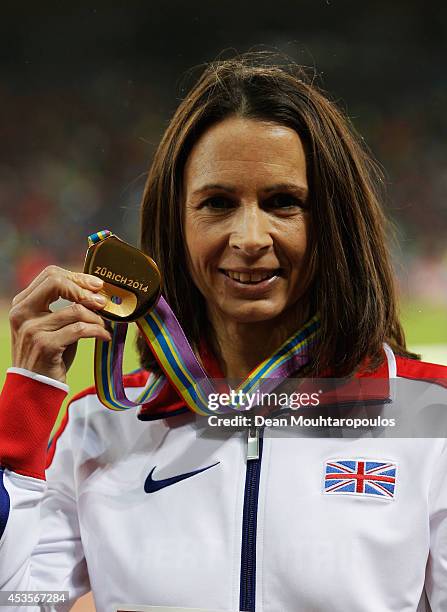 Gold medalist Jo Pavey of Great Britain and Northern Ireland poses during the medal ceremony for the Women's 10,000 metres final during day two of...