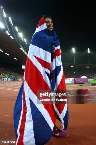 Ashleigh Nelson of Great Britain and Northern Ireland celebrates with the Union Jack after claiming the bronze medal in the competes in the Women's...