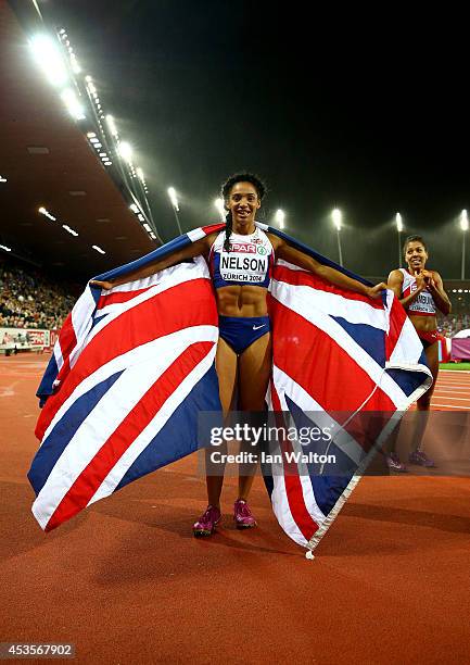 Ashleigh Nelson of Great Britain and Northern Ireland celebrates with the Union Jack after claiming the bronze medal in the competes in the Women's...