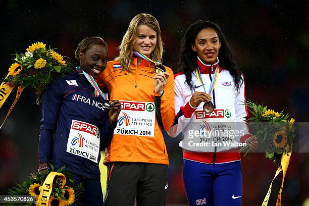 Gold medalist Dafne Schippers of the Netherlands poses next to silver medalist Myriam Soumare of France and bronze medalist Ashleigh Nelson of Great...