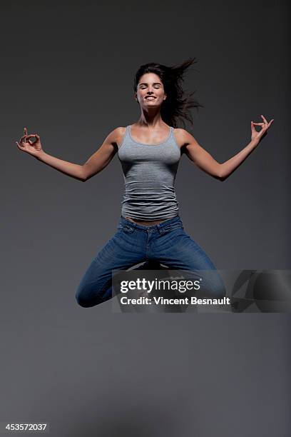 woman portrait - jumping casual clothing studio shot stock pictures, royalty-free photos & images