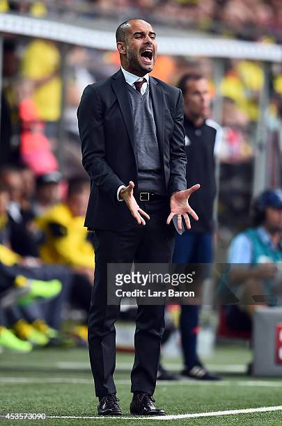 Head coach Josep Guardiola of Muenchen reacts during the DFL Supercup between Borrussia Dortmund and FC Bayern Muenchen at Signal Iduna Park on...