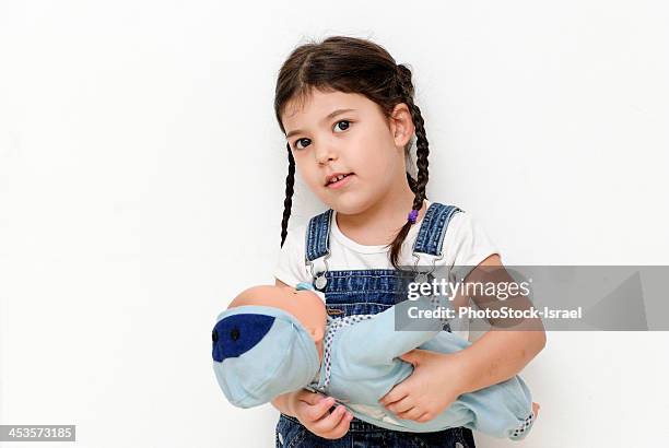 girl playing mother - doll fotografías e imágenes de stock