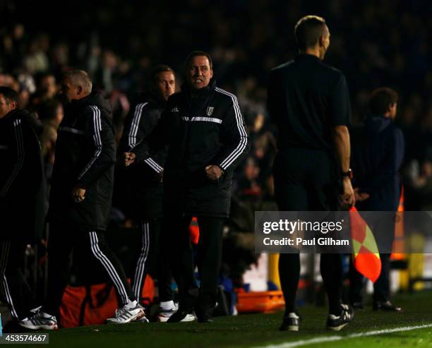 Head coach Rene Meulensteen of Fulham celebrates as Ashkan Dejagah scores their first goal during the Barclays Premier League match between Fulham...