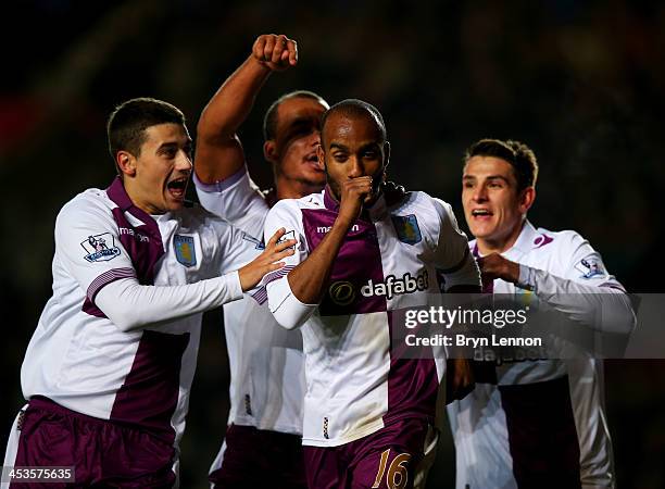 Fabian Delph of Aston Villa celebrates with team mates Matthew Lowton , Gabriel Agbonlahor and Ashley Westwood as he scores their third goal during...