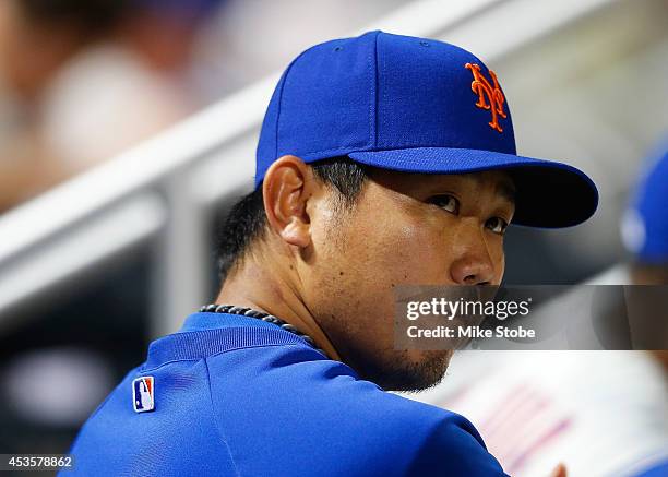 Daisuke Matsuzaka of the New York Mets looks on from the bench during the eighth inning against the Washington Nationals at Citi Field on August 13,...