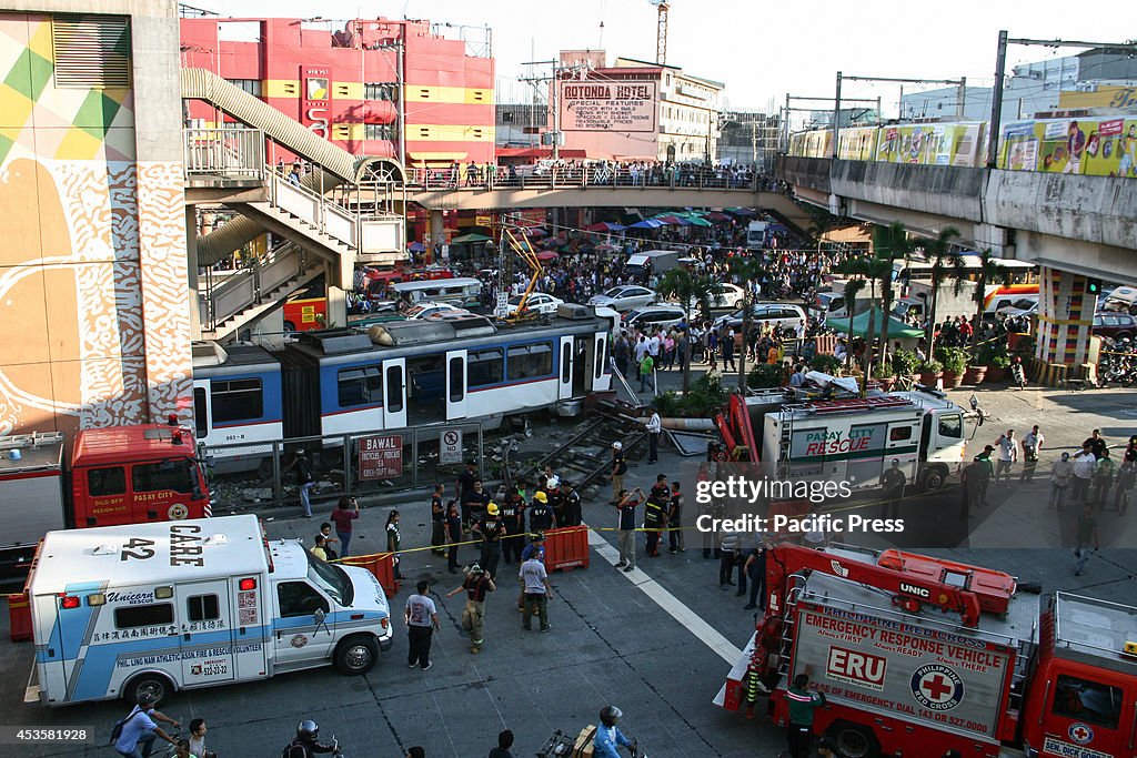Rescue vehicles surround the MRT train that overshot the...