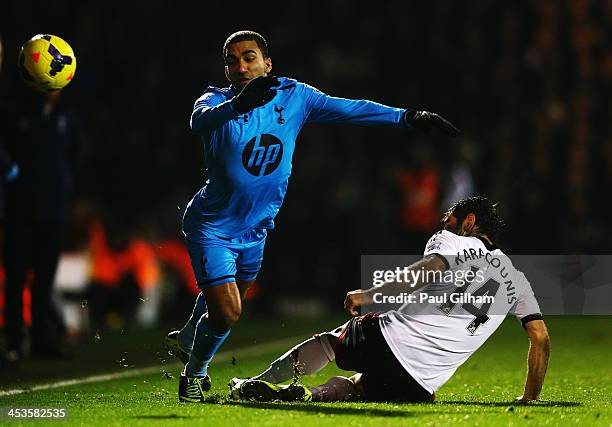 Aaron Lennon of Tottenham Hotspur is challenged by Giorgos Karagounis of Fulham during the Barclays Premier League match between Fulham and Tottenham...