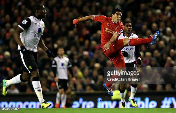 Luis Suarez of Liverpool scores his first goal from a long range effort during the Barclays Premier League match between Liverpool and Norwich City...