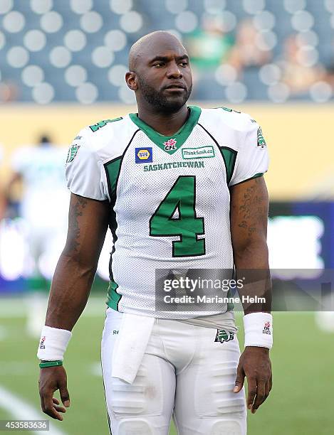 Darian Durant of the Saskatchewan Roughriders warms up on the field before a CFL game against the Winnipeg Blue Bombers at Investors Group Field on...