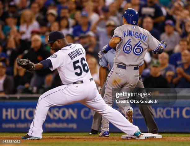 Munenori Kawasaki of the Toronto Blue Jays beats out a single in the ninth inning against closing pitcher Fernando Rodney of the Seattle Mariners at...